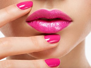 closeup-woman-hand-with-pink-nails-near-lips-fingernails-with-pink-manicure (1)